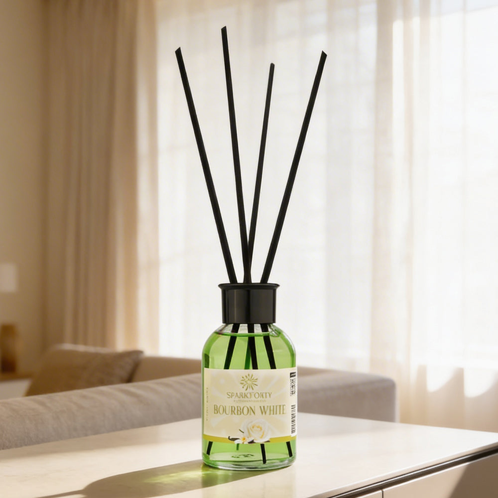 Sparkforty Bourbon White premium reed diffuser with black reeds in a green glass bottle, displayed on a coffee table in an elegant living room setting.