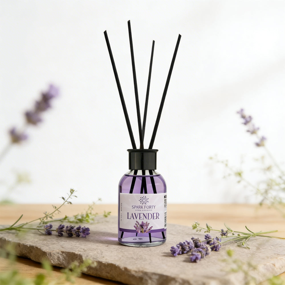 Sparkforty Lavender premium reed diffuser with black reeds in a purple glass bottle, displayed with fresh lavender flowers in an elegant home décor setting.