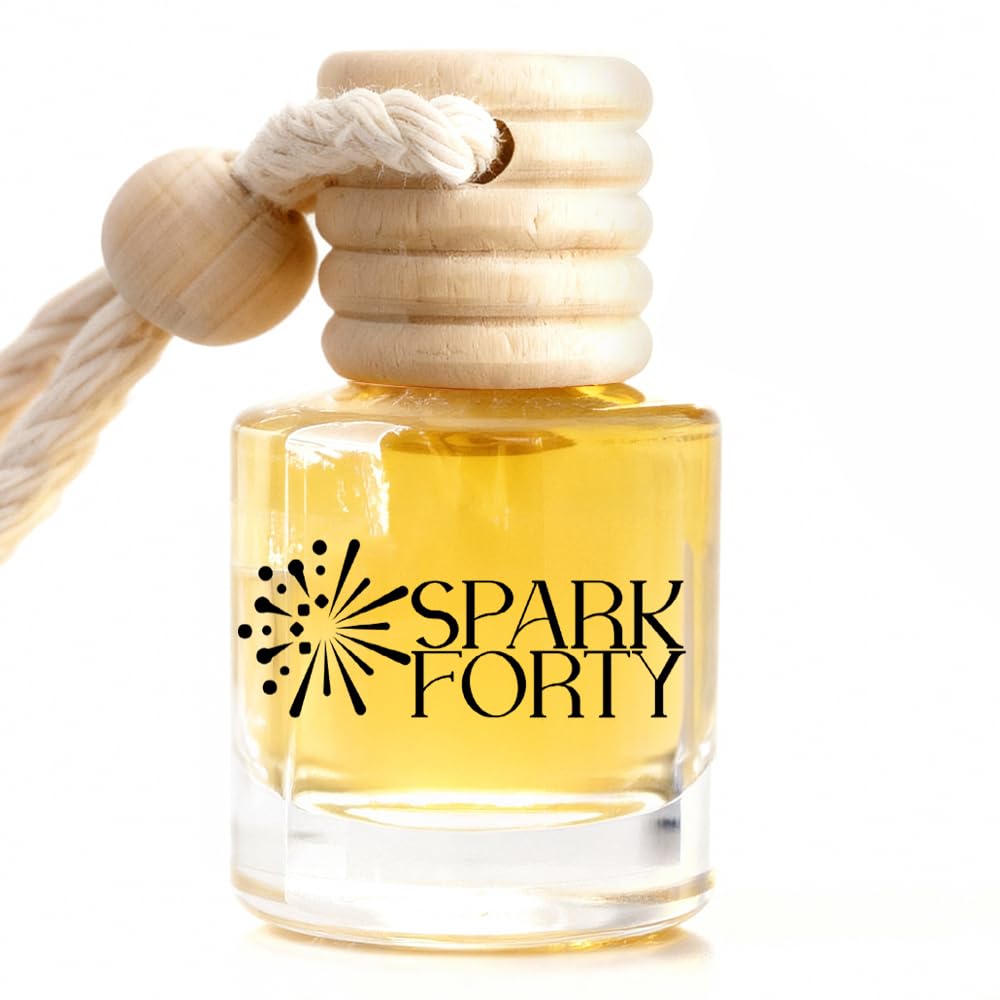 Sparkforty Ocean car air freshener featuring a clear glass fragrance bottle filled with golden liquid, a natural wooden diffuser cap, and a cotton hanging rope on a white background, showcasing a premium long-lasting ocean-inspired car fragrance.